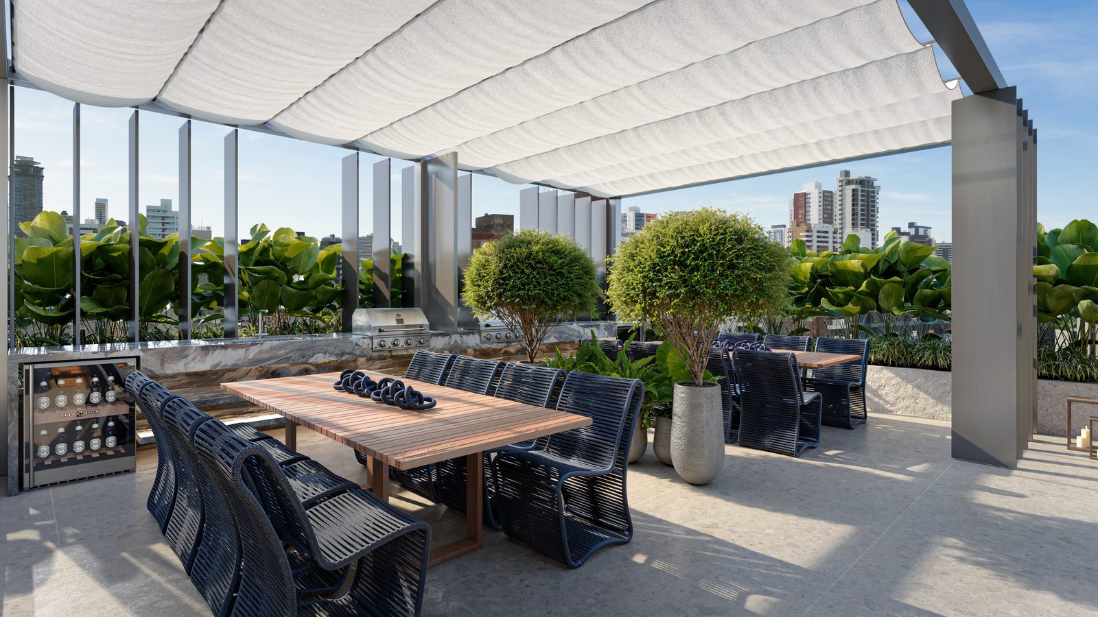 Área gourmet do rooftop do Lumini, com churrasqueira e adega
